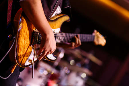 Penang, Malaysia - November 12, 2017 : Close up of a person playing a bass guitar during a private function at Batu Feringghiのeditorial素材