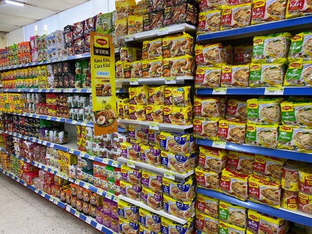 Penang, Malaysia - 16 December 2020 : Rows of packet and cup noodles for sale inside a supermarket at Farlim Ayer Itamのeditorial素材