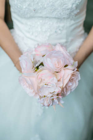 Close up of a bride holding a flower wedding bouquet