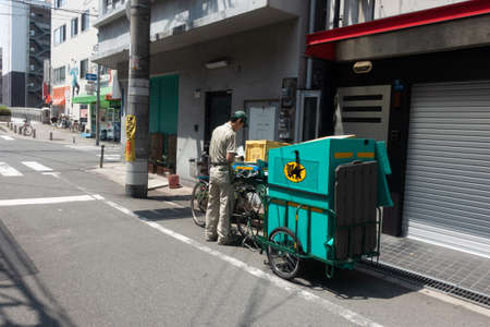 A familiar Ta-Q-Bin delivery service transport.  Ta-Q-Bin is a famous delivery service provider especially in Japan.のeditorial素材