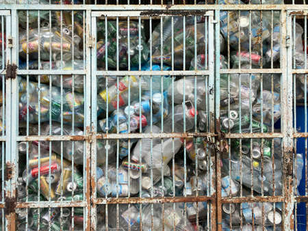Penang, Malaysia - April 29, 2921 : A recycling storage compartment with used bottles and cans. Waiting for pickupのeditorial素材