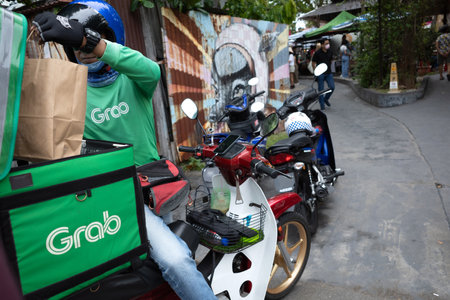 Penang, Malaysia - 14 October 2022 : Close up of the delivery bag of a Grab food rider at Georgetown, Penang.のeditorial素材