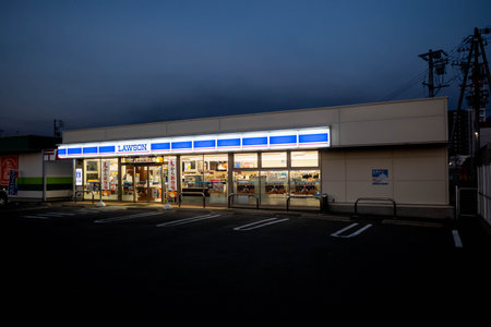 Nagano, Japan - 2 November 2023 : Front facade of a standalone Lawson convenience store with parking...