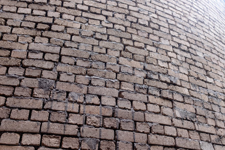 Bad brick workmanship on a wall using clay bricks in Asiaの写真素材