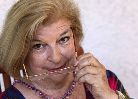 old woman with a pair of glassesの写真素材