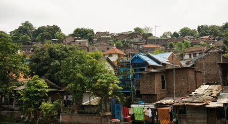 Slums on top of a hill with bush photo taken in Semarang indonesiaの写真素材