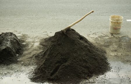 a mound of sand and  hoe photo taken in Semarang Indonesiaの写真素材