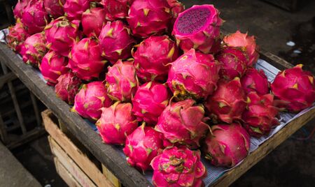 Red dragon fruit displayed on a wood box photo taken in Bogor Indonesiaの写真素材