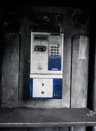 old public telephone machine left with grunge photography style effect photo taken in Jakarta...