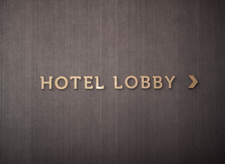 hotel lobby sign with gold color text photo taken in jogja yogyakarta indonesiaの写真素材