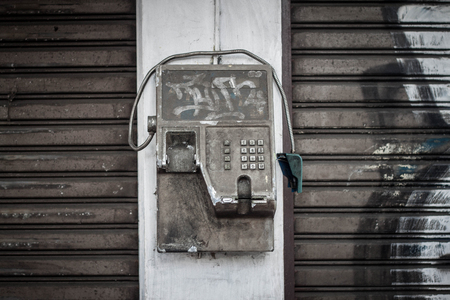 old rusty telephone photo taken in yogyakarta indonesiaの写真素材