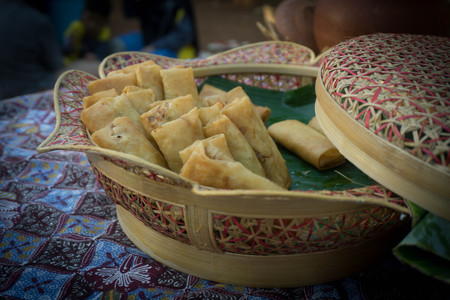 lumpia roll deep fried in wooden basket photo taken in central java indonesiaの写真素材