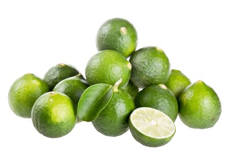 Fresh limes isolated on whiteの写真素材