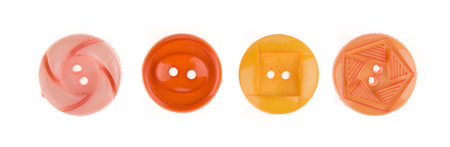 Various sewing button on white background.