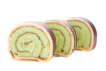 Swiss roll cake isolated on white backgroundの写真素材