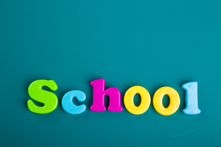 Colorful Alphabet magnetic letters on green backgroundの写真素材