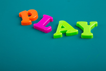 Colorful Alphabet magnetic letters on green backgroundの写真素材