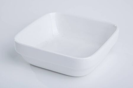 white empty plate over a white backgroundの写真素材