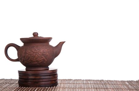 Chinese teapot and teacups set isolated on whiteの写真素材