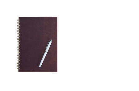 A blank brown booknote, diary cover isolated on white background, top view at the studioの写真素材