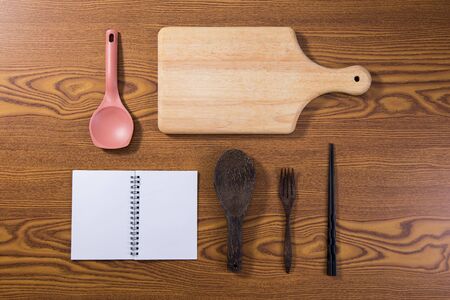 top view of recipe book with cooking stuff