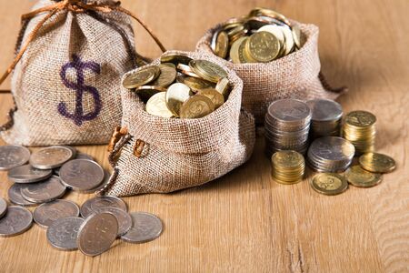 Financial concept. Coins on wooden backgroundの写真素材