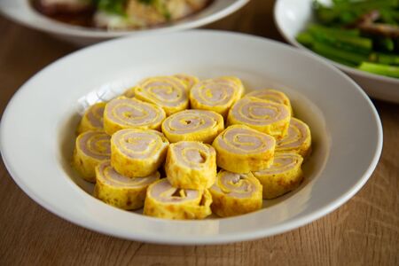 egg roll with fish paste on wooden backgroundの写真素材