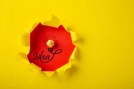 Creative idea, Inspiration, New idea and Innovation concept with Crumpled Paper light bulb on yellow background.の写真素材
