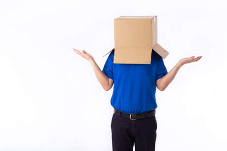 man in a bluer T-shirt with a cardboard box on his head makes a gesture with his hands isolated on...
