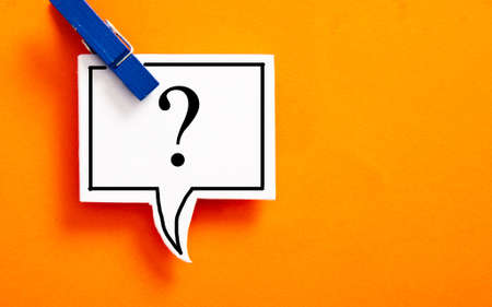 Question mark on speech bubble on orange background
