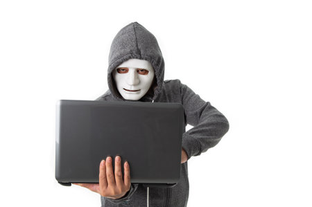 Professional hacker with laptop isolated on white background
