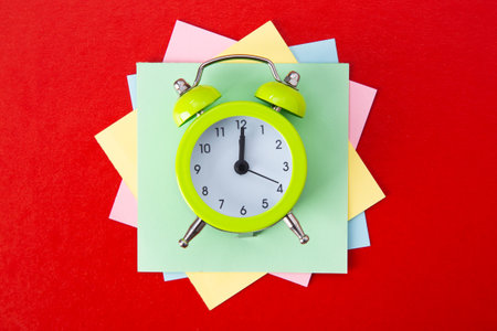 Alarm clock on red background. Copy Spaceの写真素材