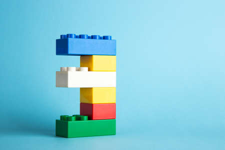 Plastic building blocks on blue backgroundの写真素材