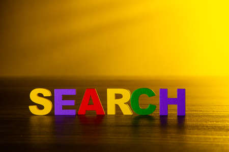 Search word text on wooden table. Ads and Search Themeの写真素材