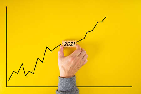 Statistical financial graph predicting an economic growth in 2021 after the 2020 global coronavirus...