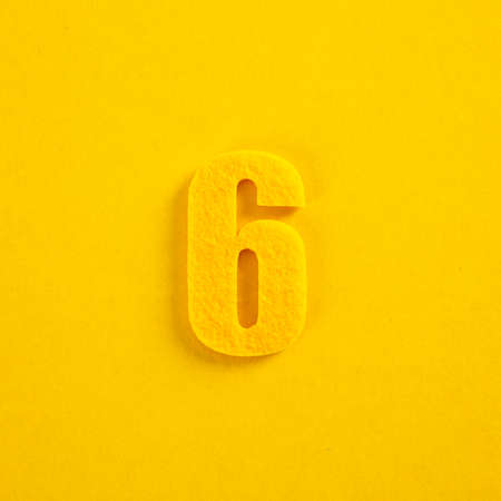 colorful number on yellow backgroundの写真素材