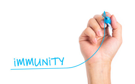 Hand drawing increasing Immunity graph with blue marker on transparent wipe board isolated on white.の写真素材