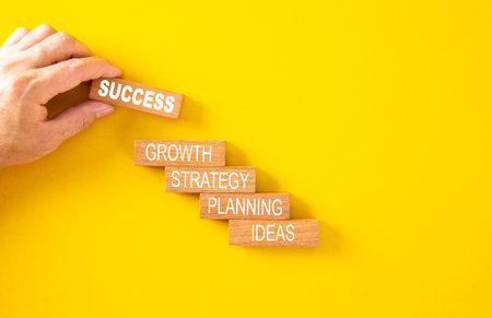 Wooden cube with the word SUCCESS, Concept of achieving a goal. Business success concept.の写真素材