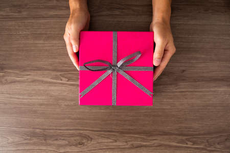 Christmas composition. Christmas gifts, decorations on wooden background. Flat lay, top view. Copy...