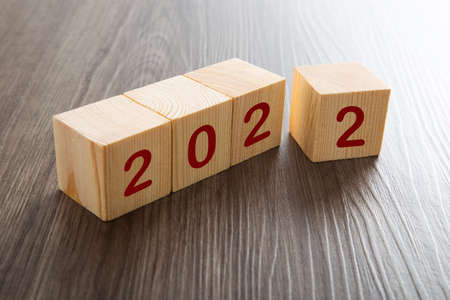 woodblocks cubes with a number 2022 wooden background. new year 2022 concept.の写真素材