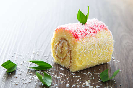 Swiss roll cake on wooden tableの写真素材