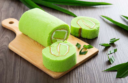 Swiss roll cake on wooden tableの写真素材