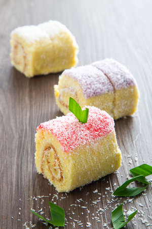 Swiss roll cake on wooden table