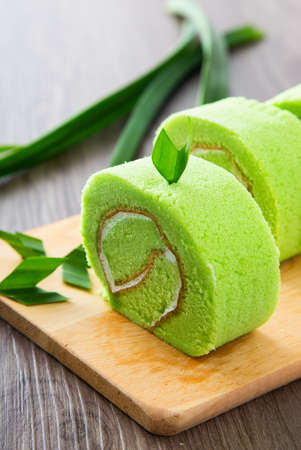 Swiss roll cake on wooden tableの写真素材