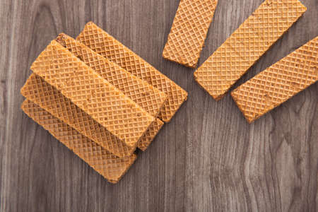 Chocolate wafer biscuit on dark wooden background.の写真素材