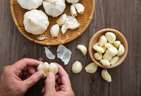 Fresh garlic on wooden table backgroundの写真素材
