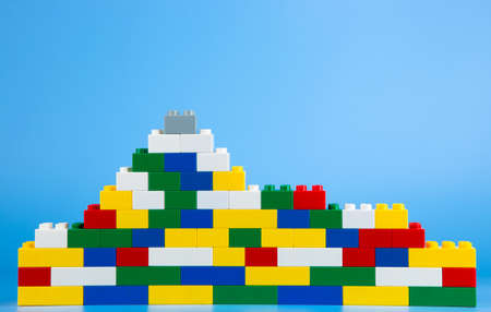 Plastic building blocks on blue backgroundの写真素材