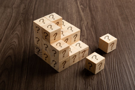 Question marks on wooden blocks, financial business conceptの写真素材