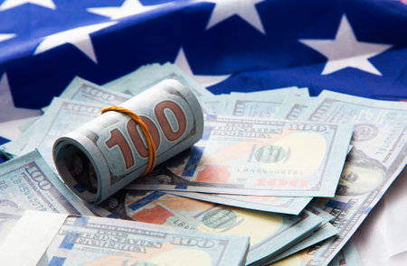 Close up of American flag and dollar cash money.の写真素材