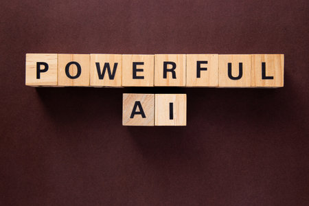 Wooden cubes spelling powerful ai representing the growing influence of artificial intelligenceの写真素材